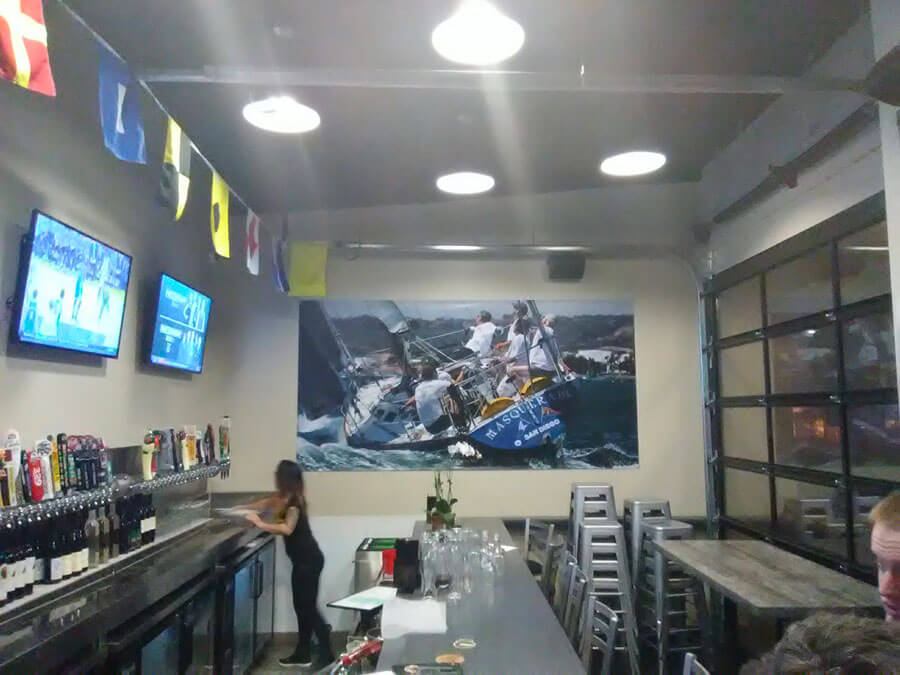 Banner print and install next to bar.